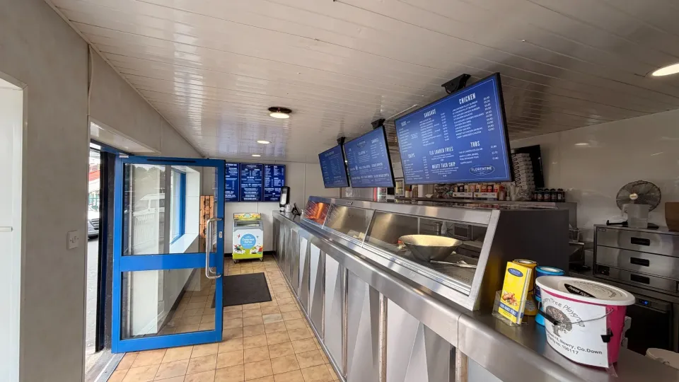 Florentines Banbridge counter with landscape digital menu screens above the serving area