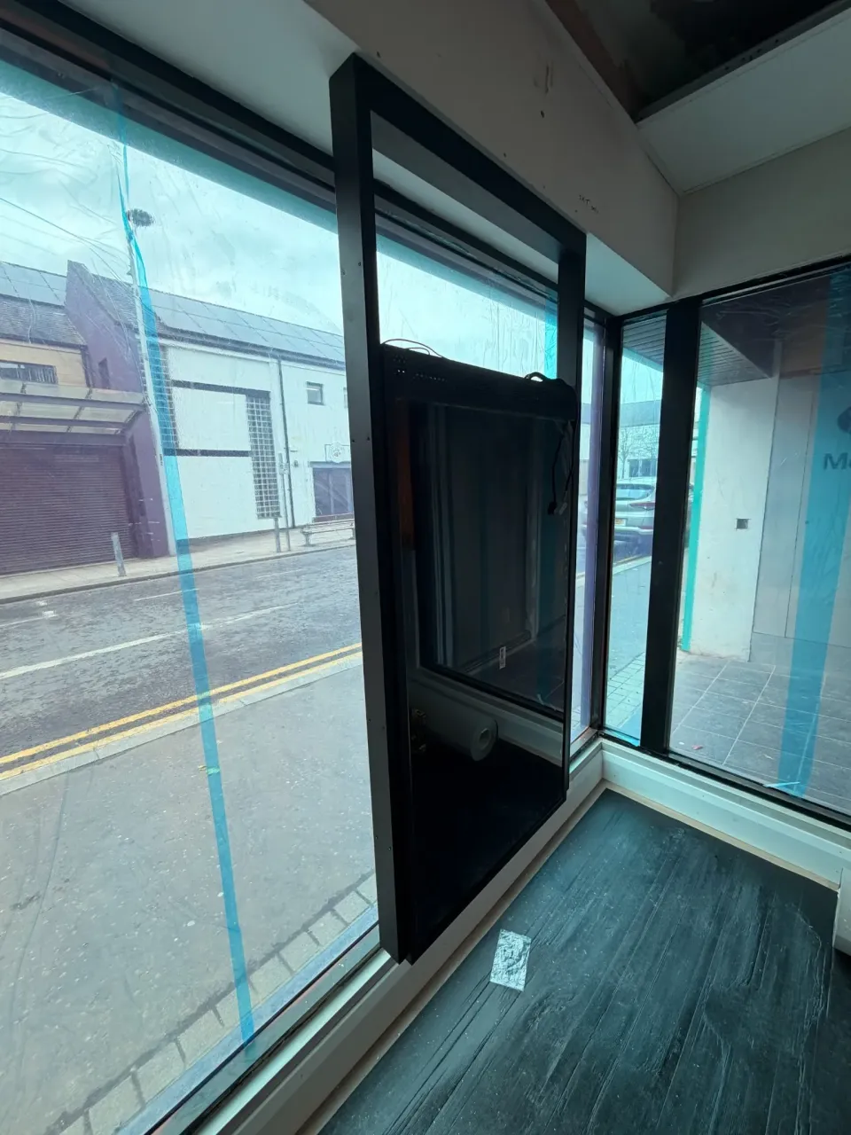 Rear of the suspended double-sided screen viewed from inside William Street Dental